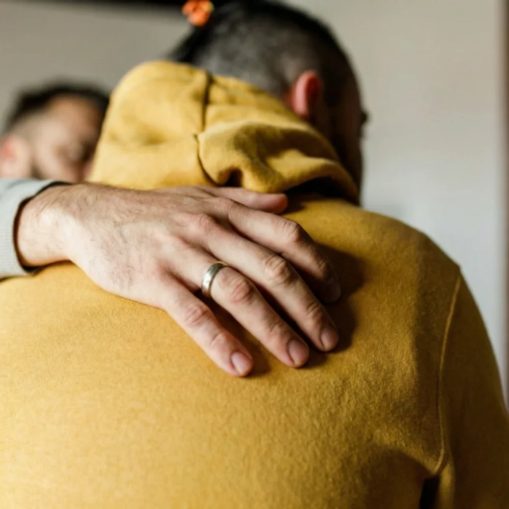 Adult embracing a child, Path Community