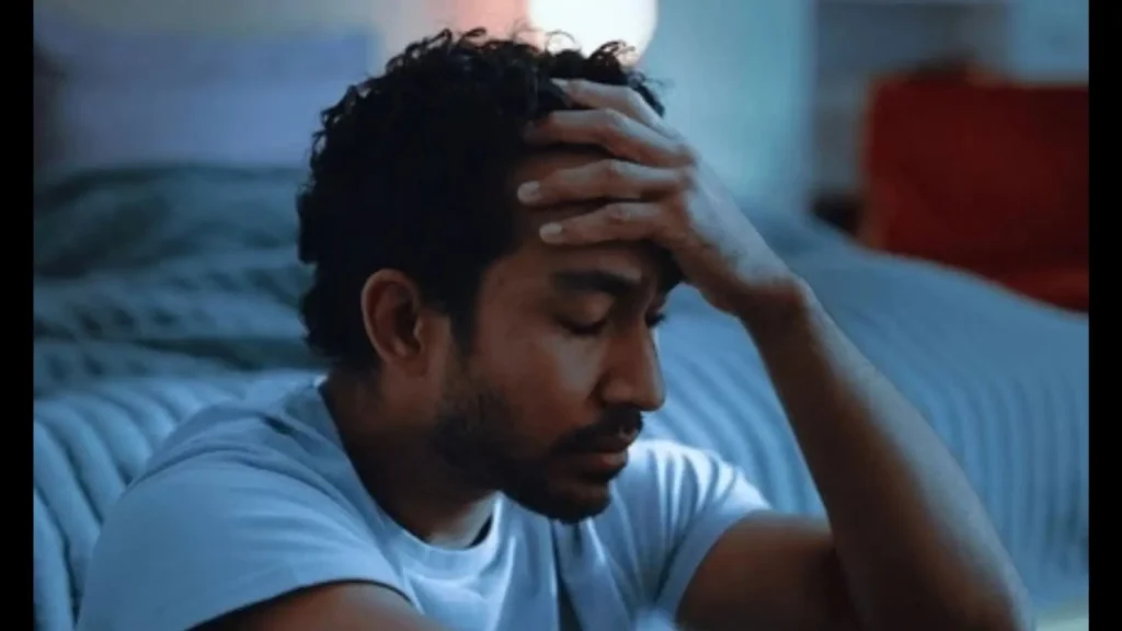 A man sitting alone, looking withdrawn and emotionally flat, Path Community men's support group